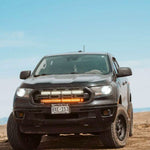black 2019 2020 2021 2022 ford ranger off roading with 2 30in light bars behind the grille color