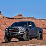 gray ford raptor generation 2 in the mountains with 2 40in behind the grille light bars color white and amber 