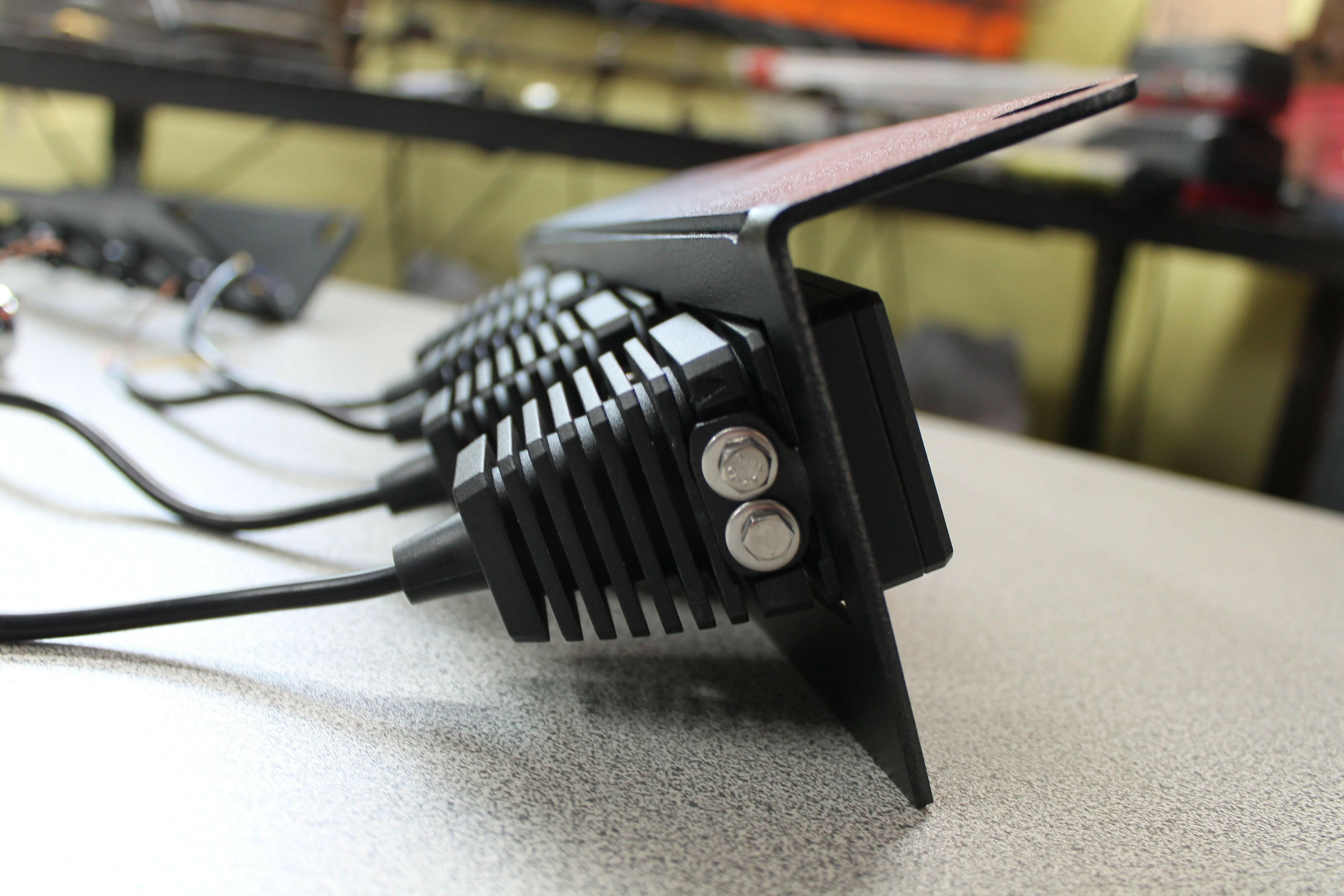 Side view 20watt light pods in metal bracket 