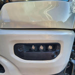 Close-up of installed RAM Rebel fog light kit 2019-2024 showing triple LED RAM Rebel fog light in front bumper