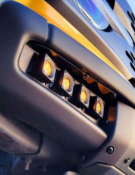 Up close view 2021 2022 2023 2024 cyber orange ford bronco modular bumper dual function fog light kit