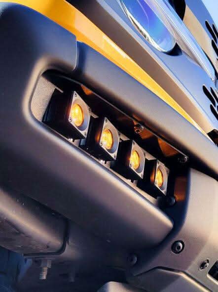 Up close view 2021 2022 2023 2024 cyber orange ford bronco modular bumper dual function fog light kit