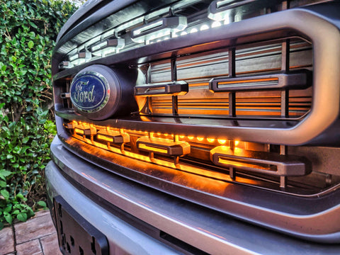 up close view light bars color amber behind the grille on 2021 2022 2023 ford f150 