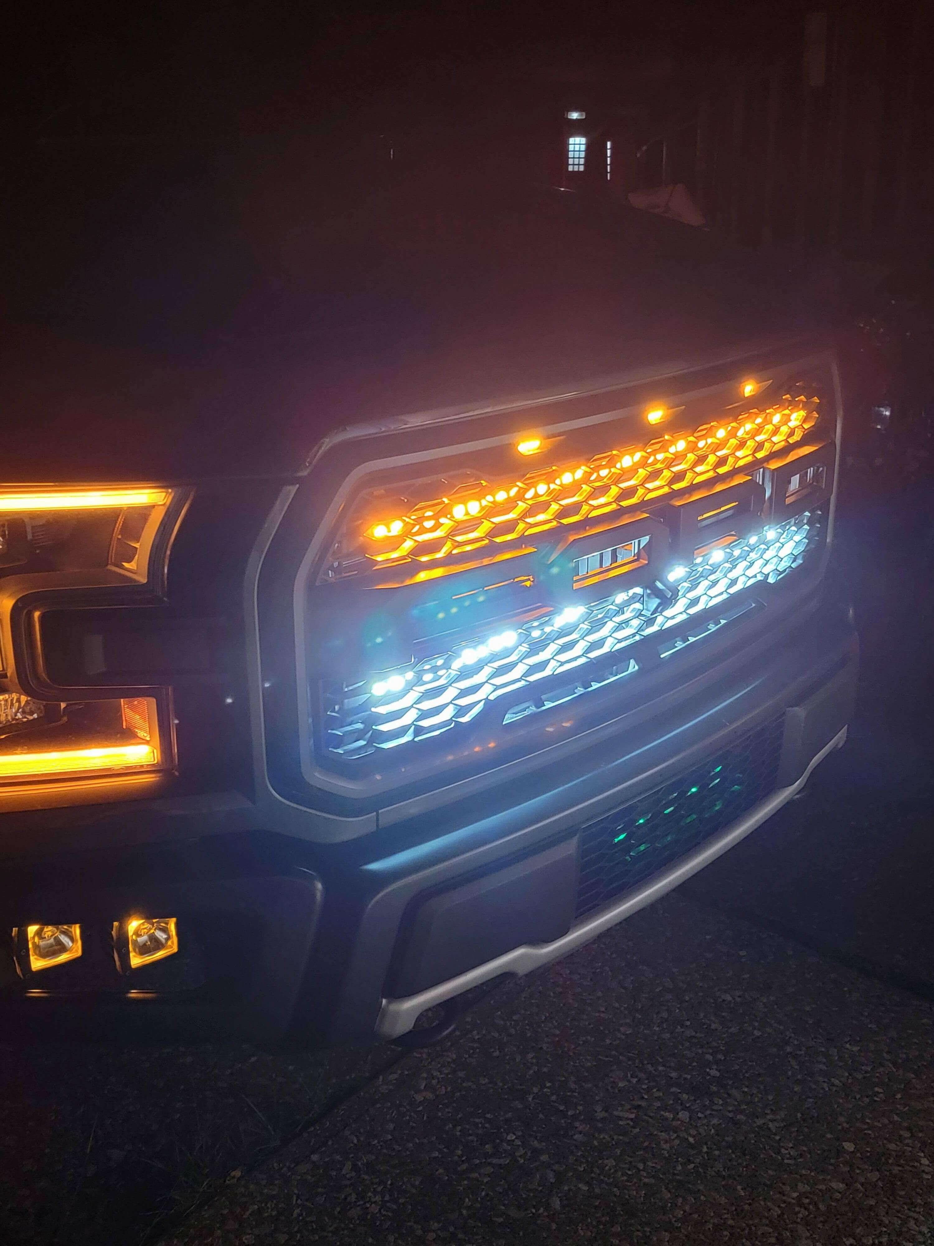 ford raptor generation 2 with 2 40in behind the grille light bars color amber in the dark