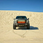 gray ford raptor generation 2 in the dessert with 2 40in behind the grille light bars color white and amber 