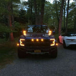 red ford raptor generation 2 2019 2020 with off roading 40watt square ditch lights in the dark