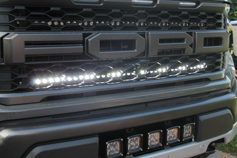 2021 2022 2023 ford raptor generation 3 with one white light bar behind the grille 
