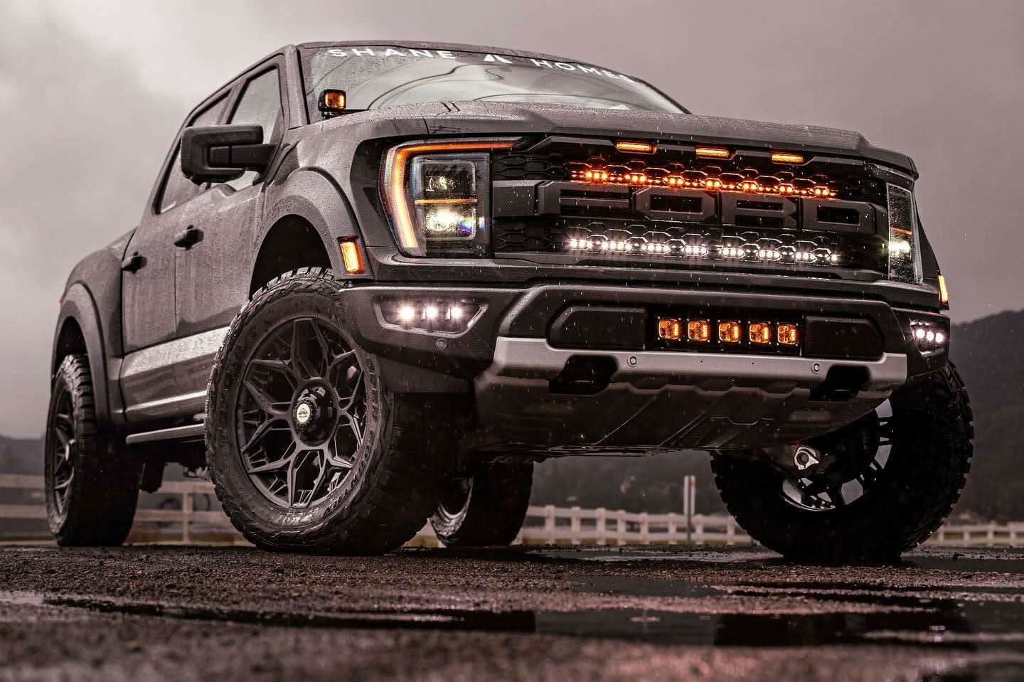 2021 2022 2023 ford raptor generation 3 standing on water with behind grille light bars color white and amber off roading
