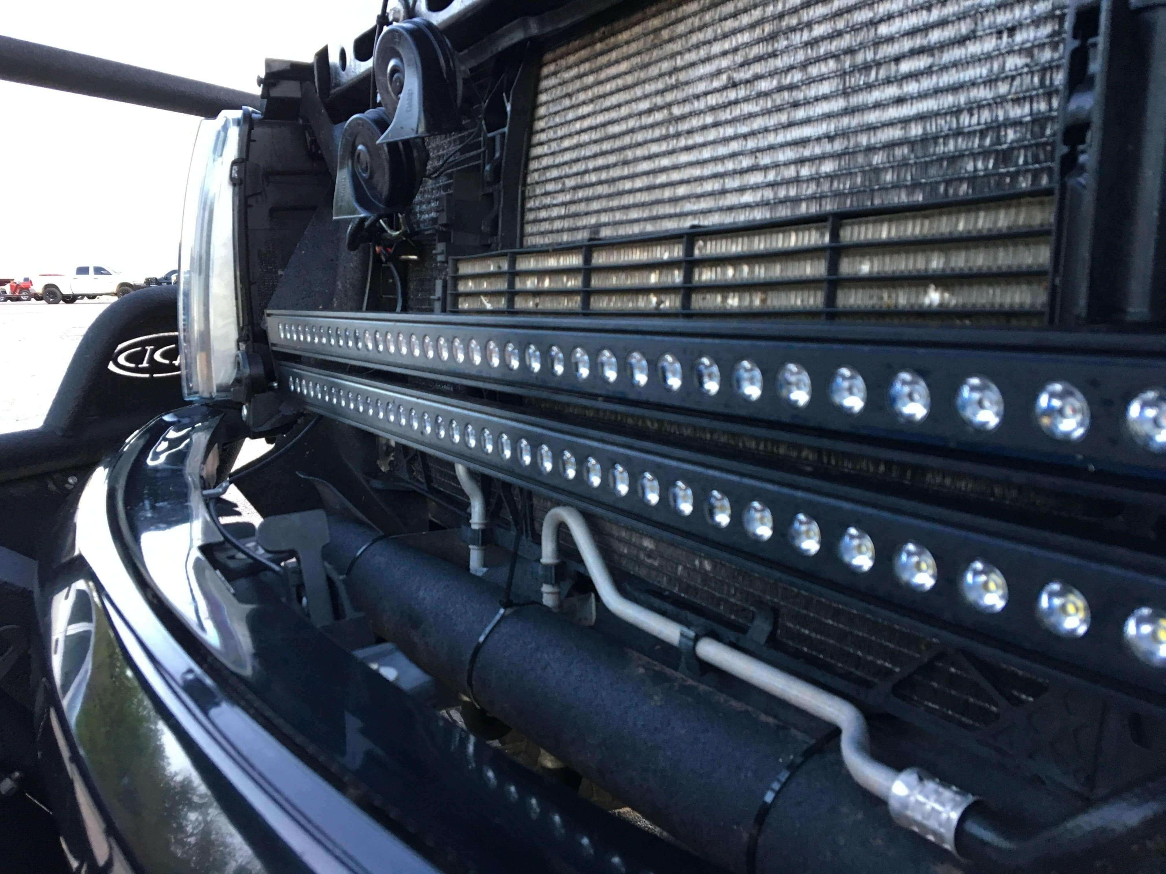 2010-2014 Ford Raptor Gen 1 dual 40in light bars mounted behind the grille, no-cut bolt-on install