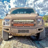 Off-road 2017-2020 truck equipped with Ford Raptor Gen 2 Light Bars dual 40s LED grille kit on rocky trail