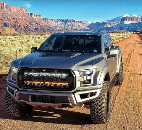 Ford Raptor Gen 2 Light Bars installed on 2017-2020 Ford Raptor truck driving off-road in desert canyon landscape