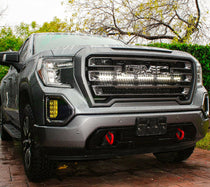 2019-2026 gray GMC Sierra 1500 with white 40-inch off-road LED light bar installed behind the grille