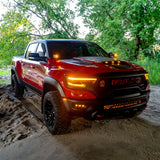 Red RAM 1500 Rebel with installed RAM Rebel Light Bar under bridge, showcasing 40in slim LED front light bar upgrade