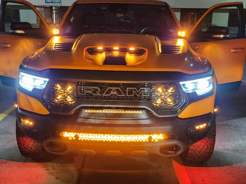 RAM Rebel Light Bar installed on yellow RAM 1500 Rebel with bright amber LED light bar illuminated at night