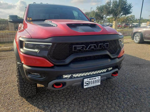 RAM Rebel Light Bar installed on red 2019-2024 RAM 1500 Rebel with single slim 40in LED light bar mounted in front bumper