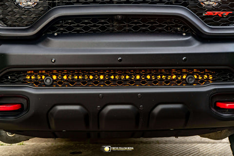 RAM Rebel Light Bar installed on 2019-2024 RAM 1500 Rebel front bumper with single 40in slim LED bar illuminated