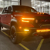 RAM Rebel Light Bar single 40in slim front bumper LED on red RAM 1500 Rebel 2019-2024 at night in parking lot